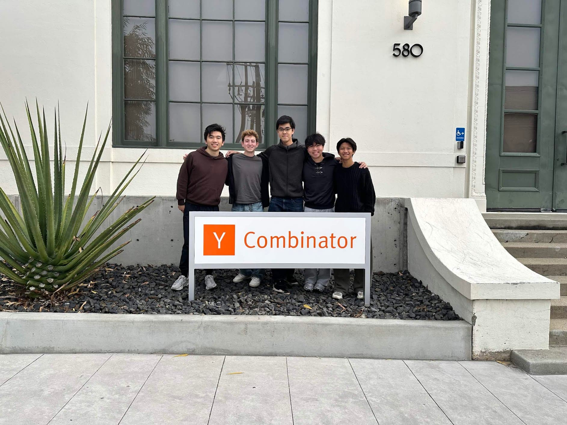Team of five outside the Y Combinator office