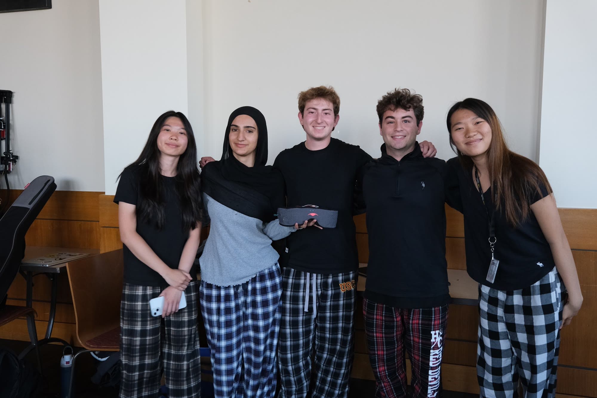 Group of five posing together indoors