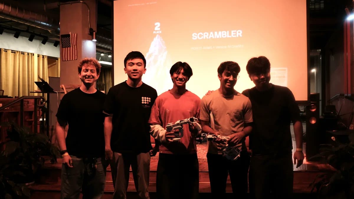 Scrambler team on stage in front of the project title